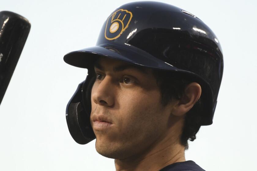 Milwaukee Brewers' Christian Yelich waits to bat during the first inning of Game 4 of the National League Championship Series baseball game against the Los Angeles Dodgers Tuesday, Oct. 16, 2018, in Los Angeles. (AP Photo/Harry How, Pool)