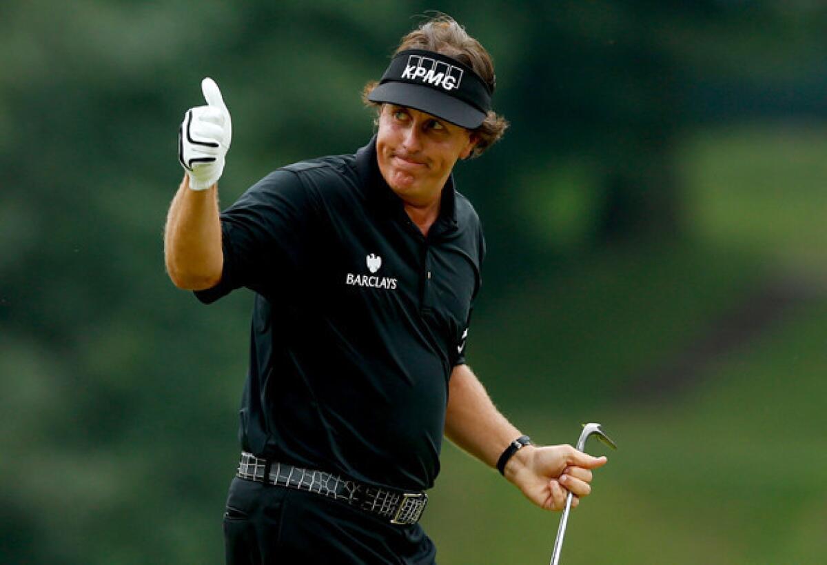 Phil Mickelson celebrates after making a shot for eagle on the tenth hole during the final round of the U.S. Open at Merion Golf Club.