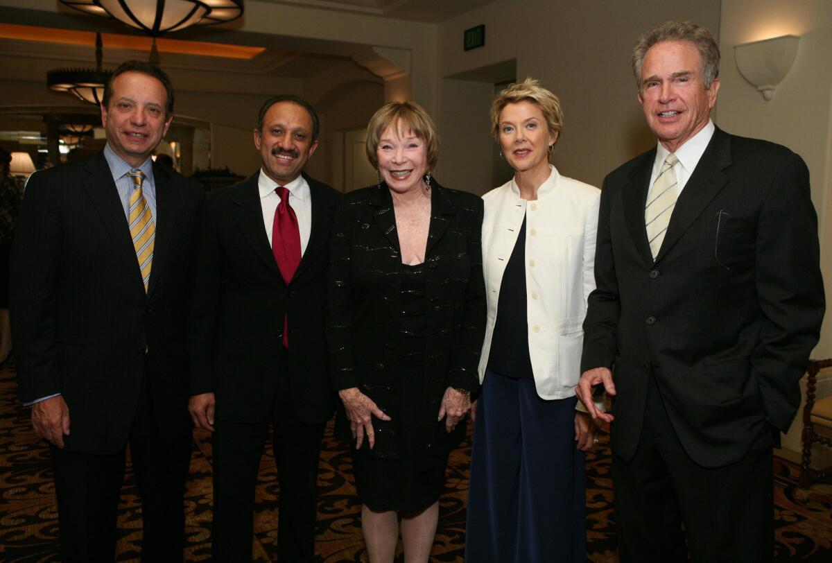 Then-Dean Carmen A. Puliafito, left, Dr. Inderbir Gill, actress Shirley MacLaine, actress Annette Bening and actor Warren Beatty at a USC event at the Montage Beverly Hills hotel in May 2009.