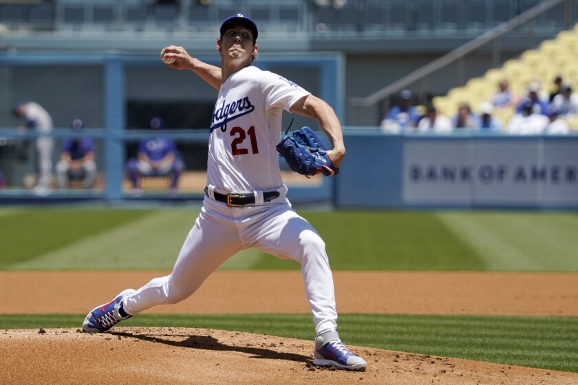 Los Angeles Dodgers starting pitcher Walker Buehler throws to the plate during the first inning of a baseball game against the Texas Rangers Sunday, June 13, 2021, in Los Angeles. (AP Photo/Mark J. Terrill)
