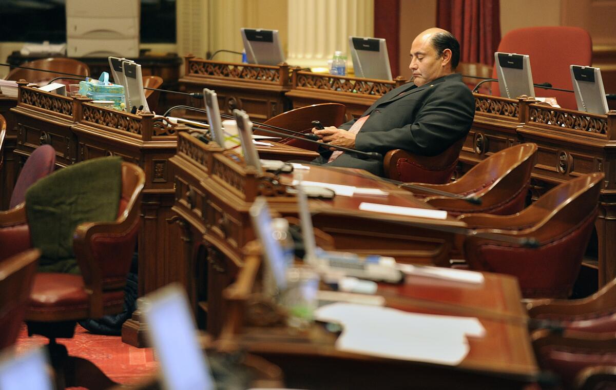 Sen. Lou Correa (D-Santa Ana), here checking a message in the Senate chambers in 2009, could not secure enough votes Monday to pass a campaign finance disclosure bill.