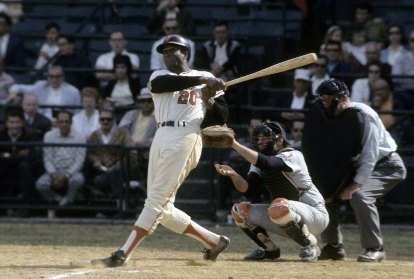 Baltimore Orioles' Frank Robinson watches the flight of his ball during a game at Memorial Stadium in Baltimore, Maryland.