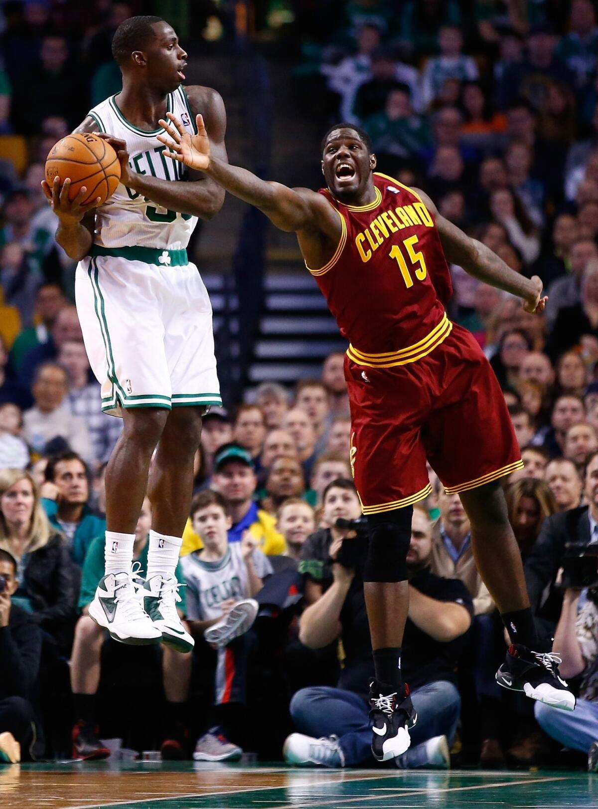 Boston's Brandon Bass, left, grabs a rebound in front of Cleveland's Anthony Bass during the Celtics' 103-100 win Saturday. Bennett isn't the only rookie who's having a disappointing season.