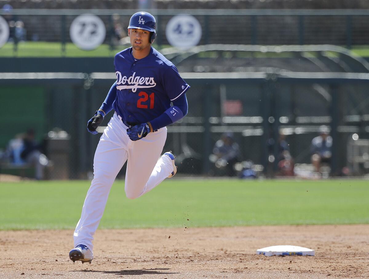 Dodgers outfielder Trayce Thompson rounds the bases after hitting a three-run homer against the Milwaukee Brewers during the first inning.