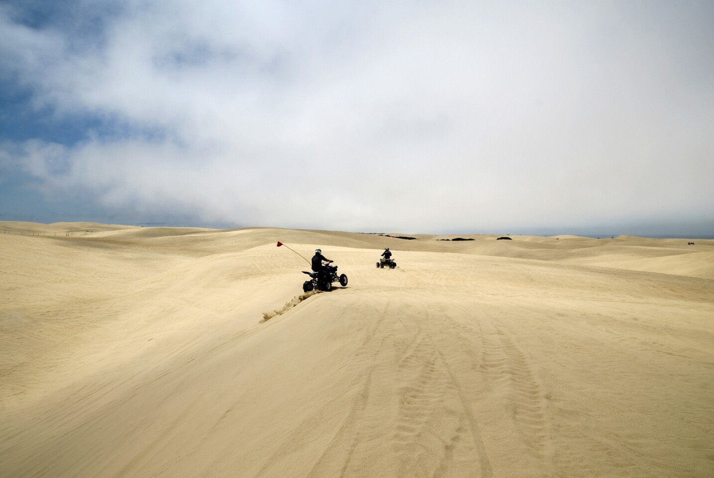 Off-road vehicles at Pismo Beach dunes.