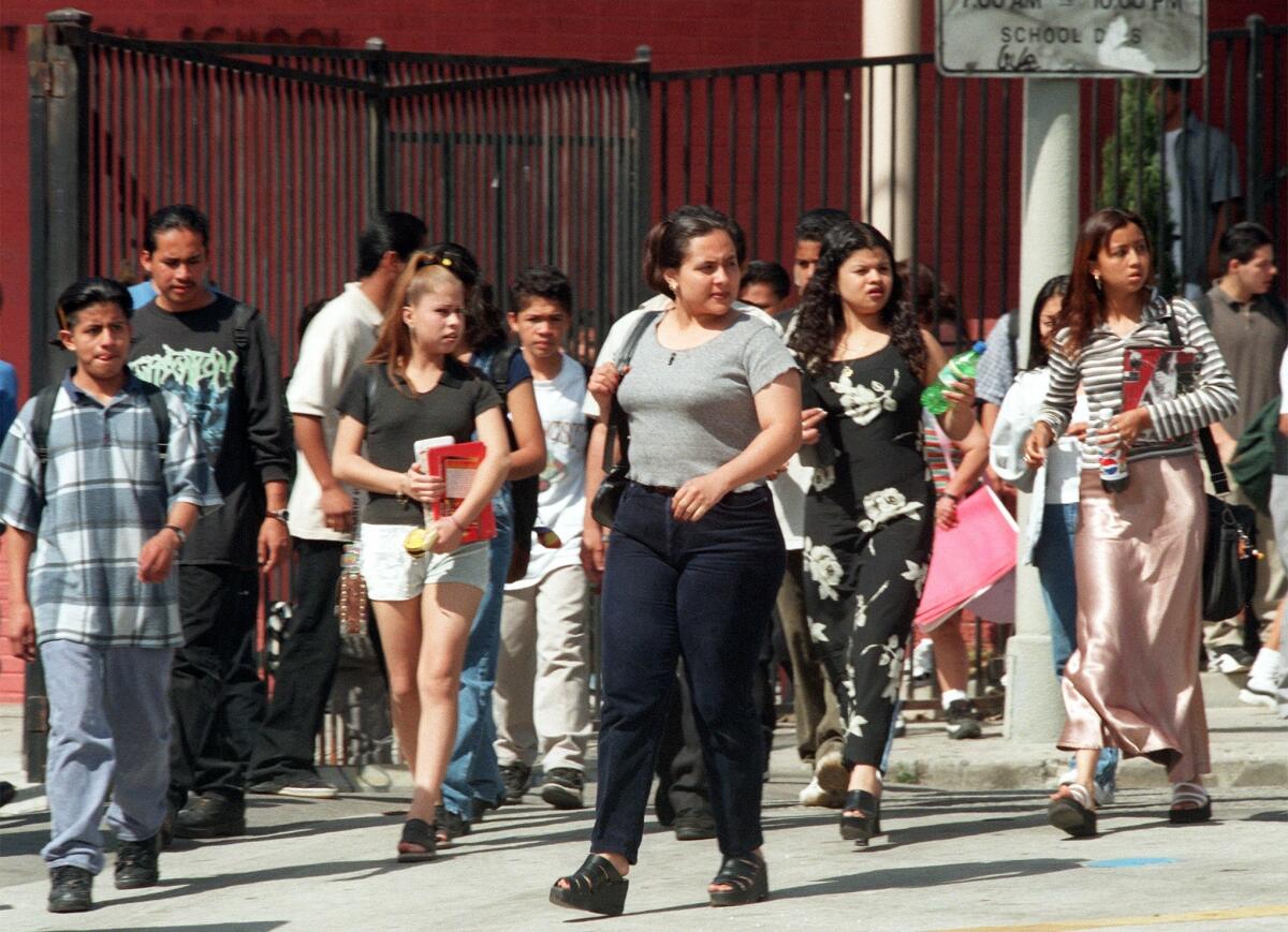 Students leaving Belmont High School, west of downtown, in 1997. Before the new schools opened, it served more than 5,000 students for nine years. Others had to be bused out of the neighborhood. (Lawrence K. Ho/Los Angeles Times)