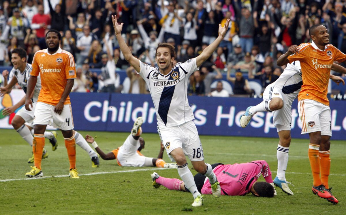 Forward Mike Magee (18) celebrates a goal by Omar Gonzalez during the second half of the Galaxy's 3-1 win over Houston to win the MLS Cup on Dec. 1, 2012.