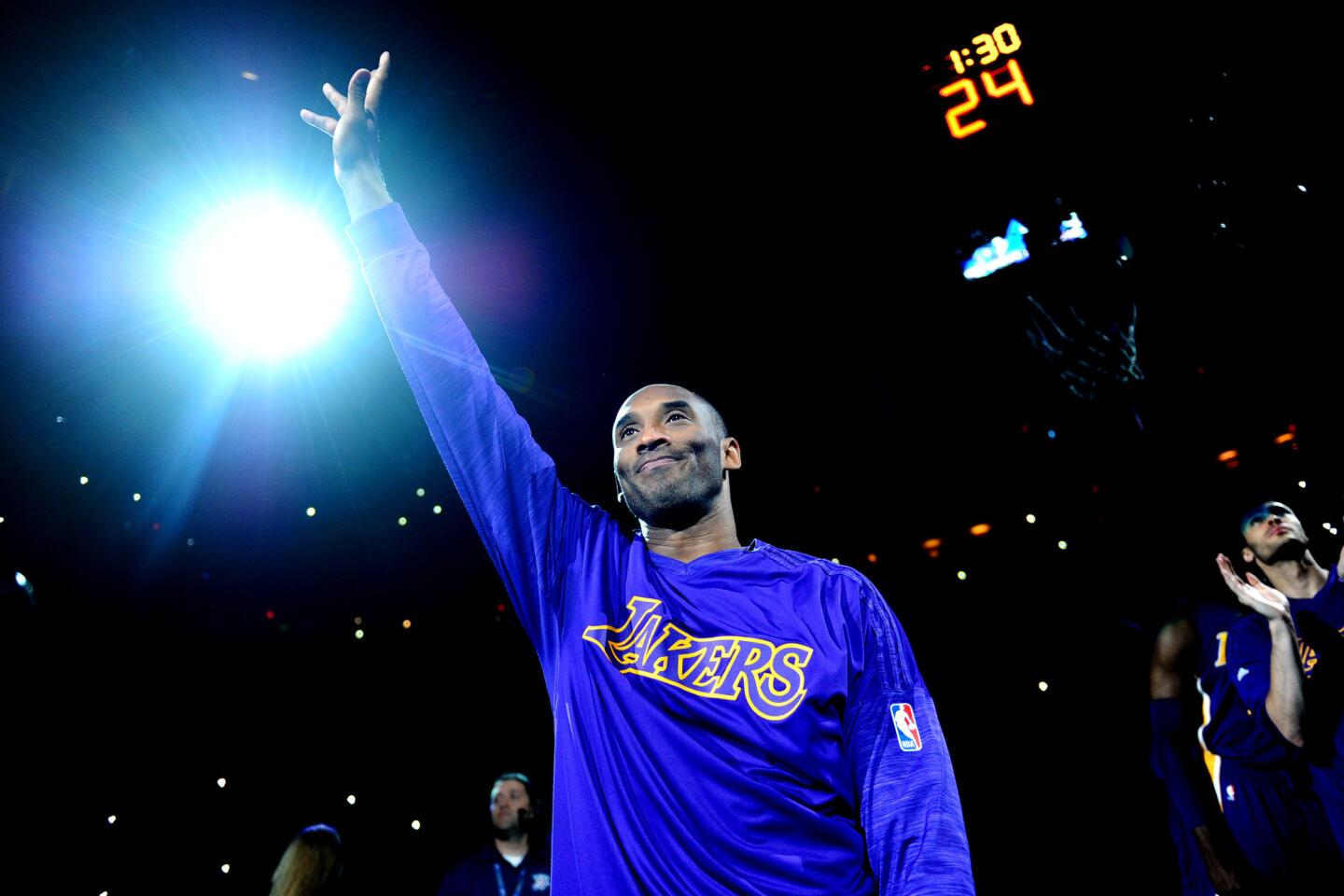 Kobe Bryant waves to the crowd as he is introduced before a game against the Thunder in Oklahoma City on April 11.