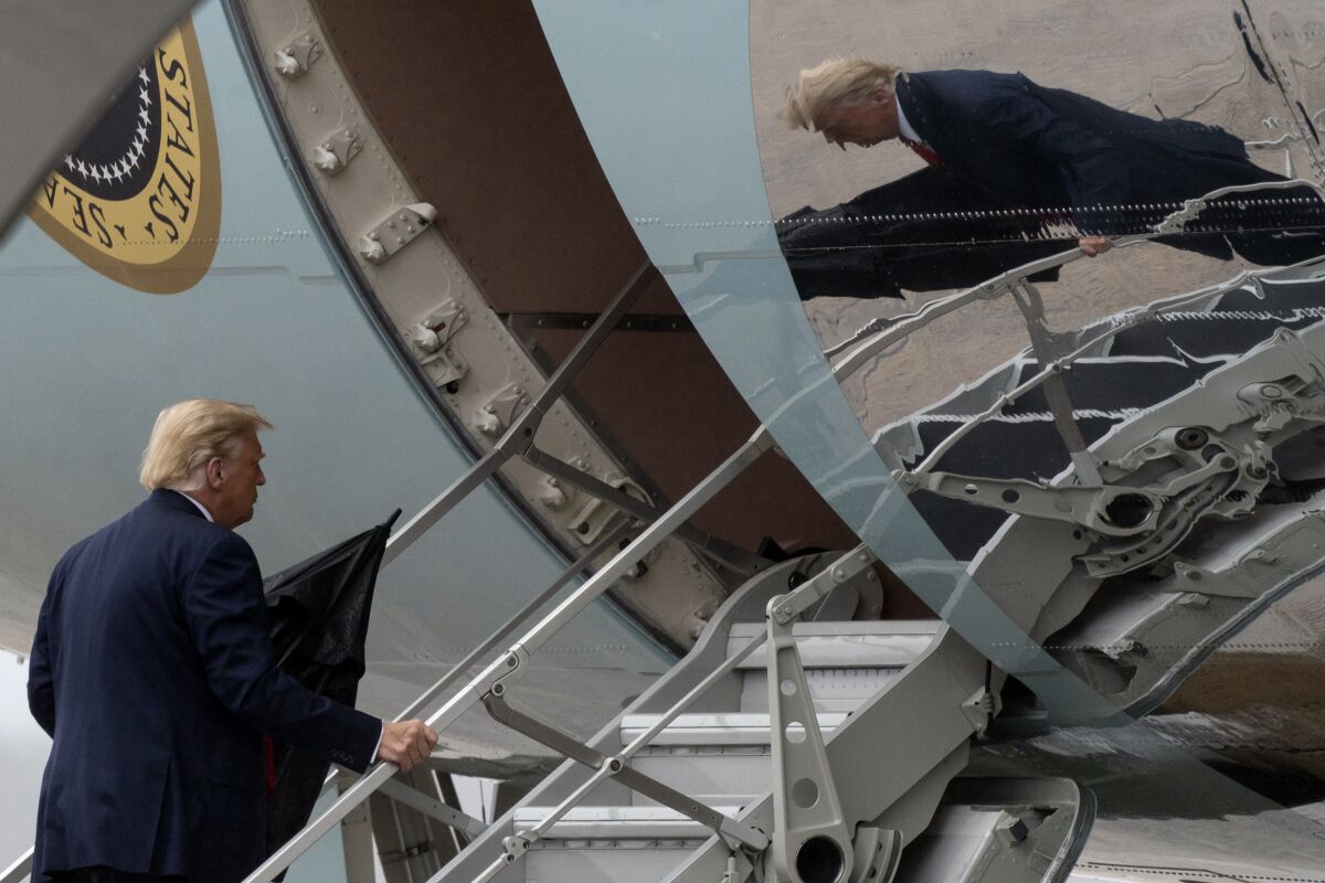 President Donald Trump boards Air Force One, Monday, Oct. 12, 2020.