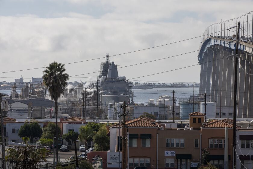 San Diego, California - January 21: An image of Barrio Logan facing the San Diego Bay that has residential houses surrounded by the Coronado Bridge, NASCO and the Navy Barrio Logan on Friday, Jan. 21, 2022 in San Diego, California. (Ana Ramirez / The San Diego Union-Tribune)