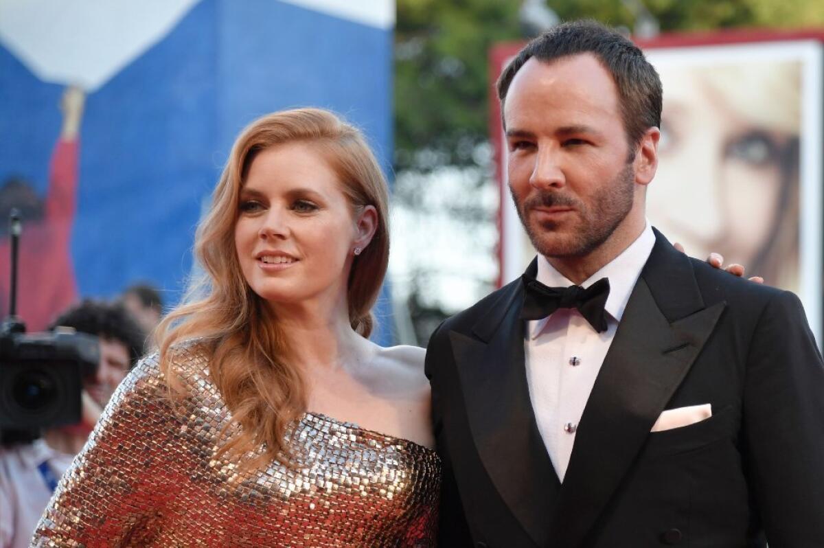 Amy Adams arrives with director and fashion designer Tom Ford for the premiere of their new film, "Nocturnal Animals," at the Venice Film Festival on Sept. 2.