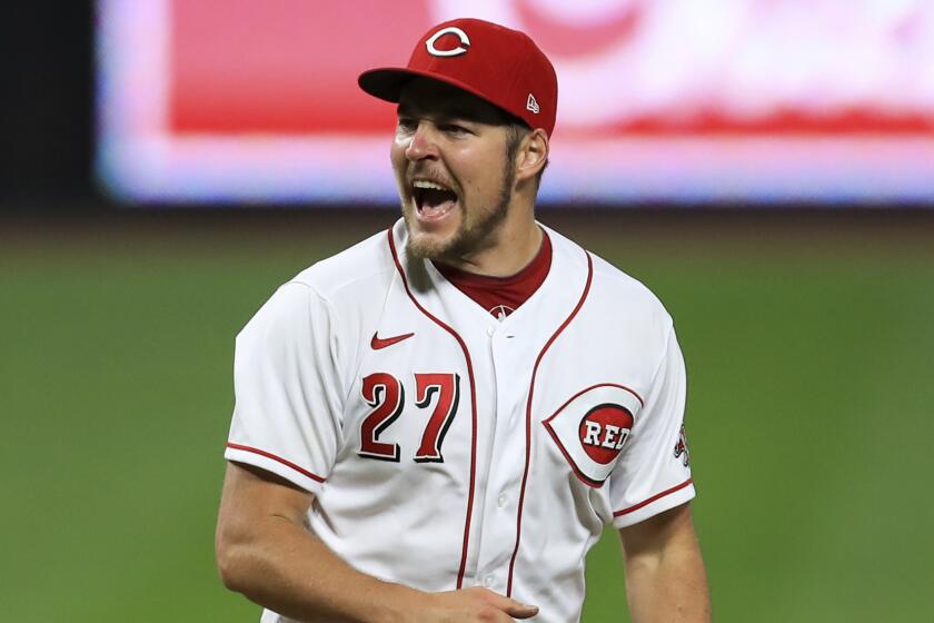 FKILE - Cincinnati Reds' Trevor Bauer reacts after recording a strikeout against Milwaukee Brewers.