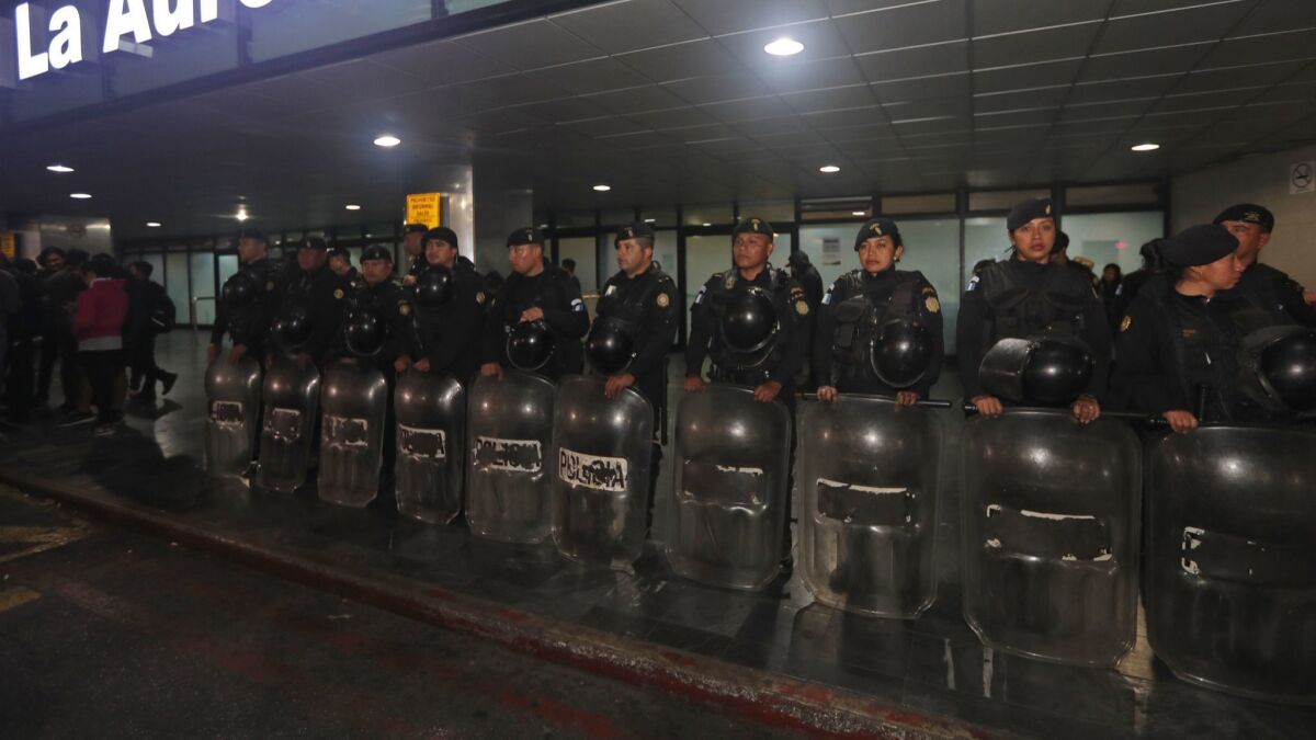 Anti-riot police stand guard at the La Aurora International Airport in Guatemala City, Guatemala on Jan. 6.