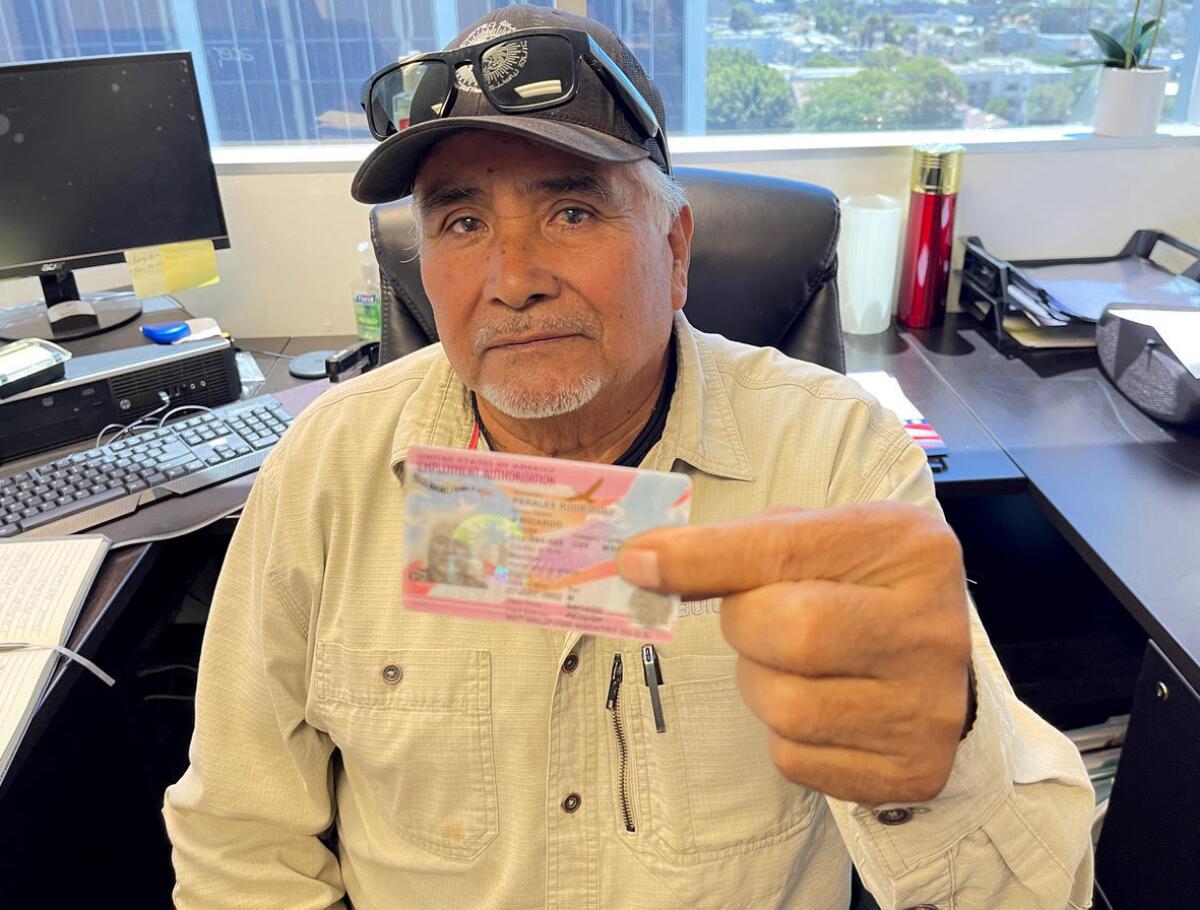 Ricardo Rodriguez shows his work permit. 
