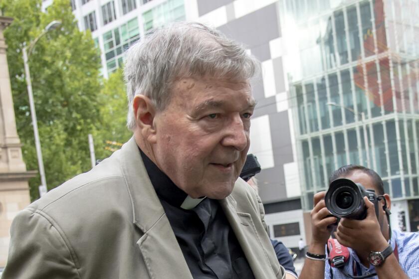 In this Feb. 26, 2019, photo, Cardinal George Pell leaves the County Court in Melbourne, Australia. Australia’s highest court on Tuesday, April 7, 2020 will judge Pell’s appeal against convictions for molesting two teenage choirboys more than two decades ago. But the legal battle over the world’s most senior Catholic convicted of sexually abusing children may not end there. (AP Photo/Andy Brownbill)