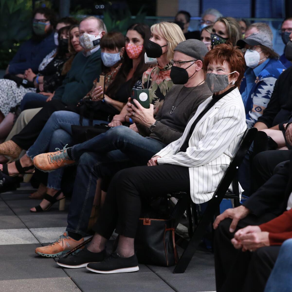 Marion Ross sits among an audience.