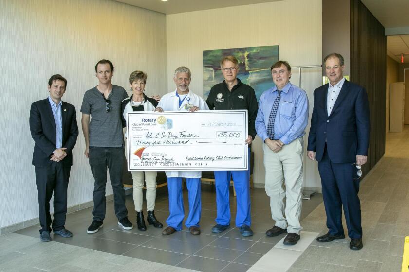 Alex Nunes (PLRC President), Andrew Krause (son of Jim Krause), Gail Krause (widow of Jim Krause), Dr. Andrew Lowy (UCSD Chief, Division of Surgical Oncology), Dr. Michael Bouvet (UCSD Director of Endocrine Surgery), Dr. Tony Reid (UCSD Pancreatic Cancer Research) and Richard Stakelum (RTP Director)