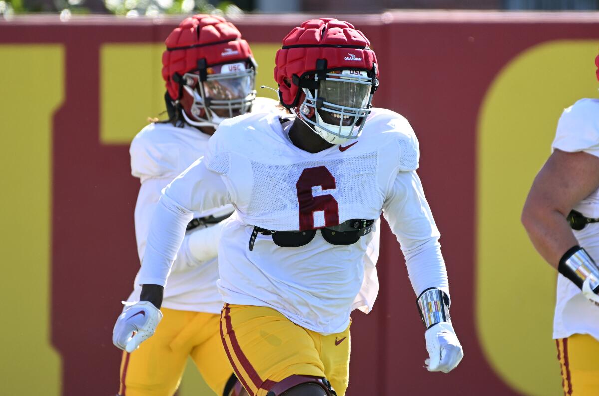 USC defensive lineman Anthony Lucas runs through drills at practice.