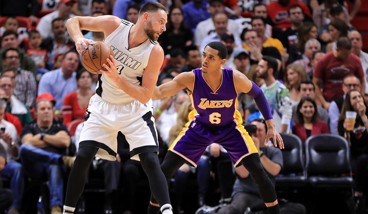 The Miami Heat's Josh McRoberts, left, posts up Lakers' Jordan Clarkson during the game Thursday.