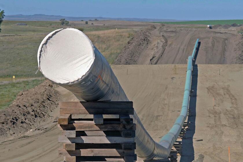 FILE - This Sept. 29, 2016, file photo, shows a section of the Dakota Access pipeline under construction near St. Anthony in Morton County, N.D. The Dakota Access pipeline system leaked about 100 gallons of oil in western North Dakota in two separate incidents in March as crews worked to get the four-state line ready for operation. Theyâre the second and third known leaks on the disputed $3.8 billion pipeline. (Tom Stromme/The Bismarck Tribune via AP, File)