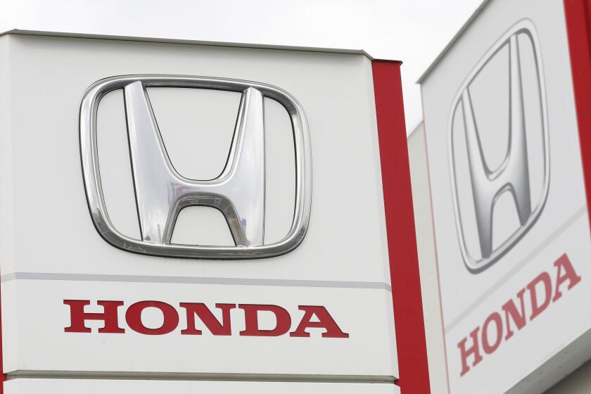 FILE - Logos of Honda Motor Co. are pictured in Tsukuba, northeast of Tokyo, Feb. 13, 2019. (Kyodo News via AP, File)