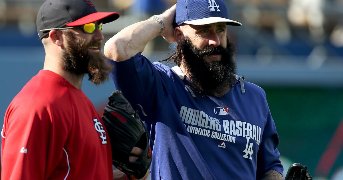 Dodgers' May saved flowing locks in high school by pitching well