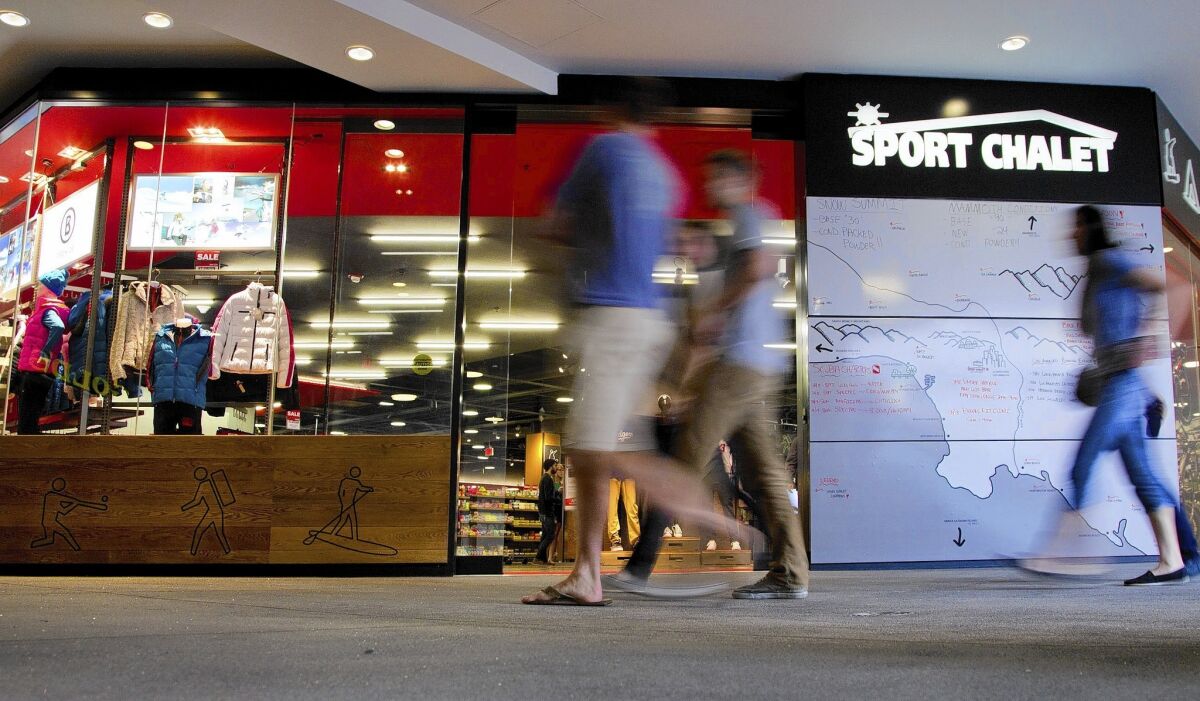 The Sport Chalet at the Figueroa and 7th Street shopping center in downtown Los Angeles posts ski conditions outside during the season. Sport Chalet, started in the foothills of the San Gabriel Mountains, has been sold to an East Coast firm.