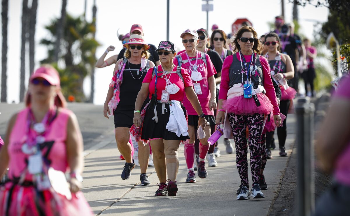 Participants walk on their 60-mile trek Nov. 20 as part of the Susan G. Komen 3-Day.