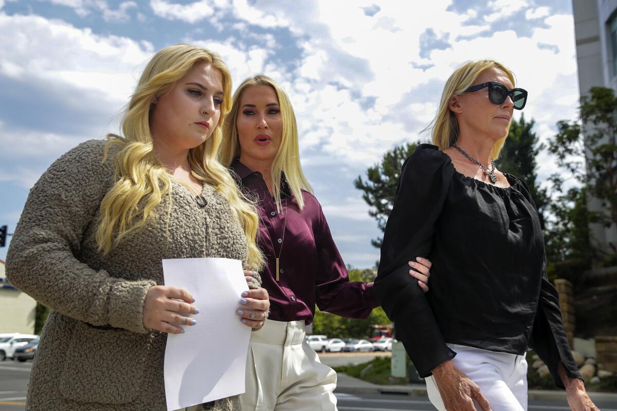 Three women walk together