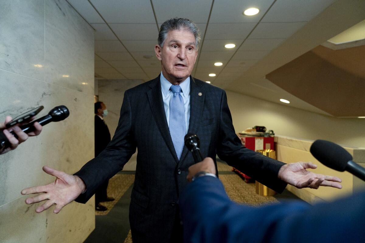 Sen. Joe Manchin (D-W.Va.) speaks to reporters on Capitol Hill in Washington on Oct. 27. 