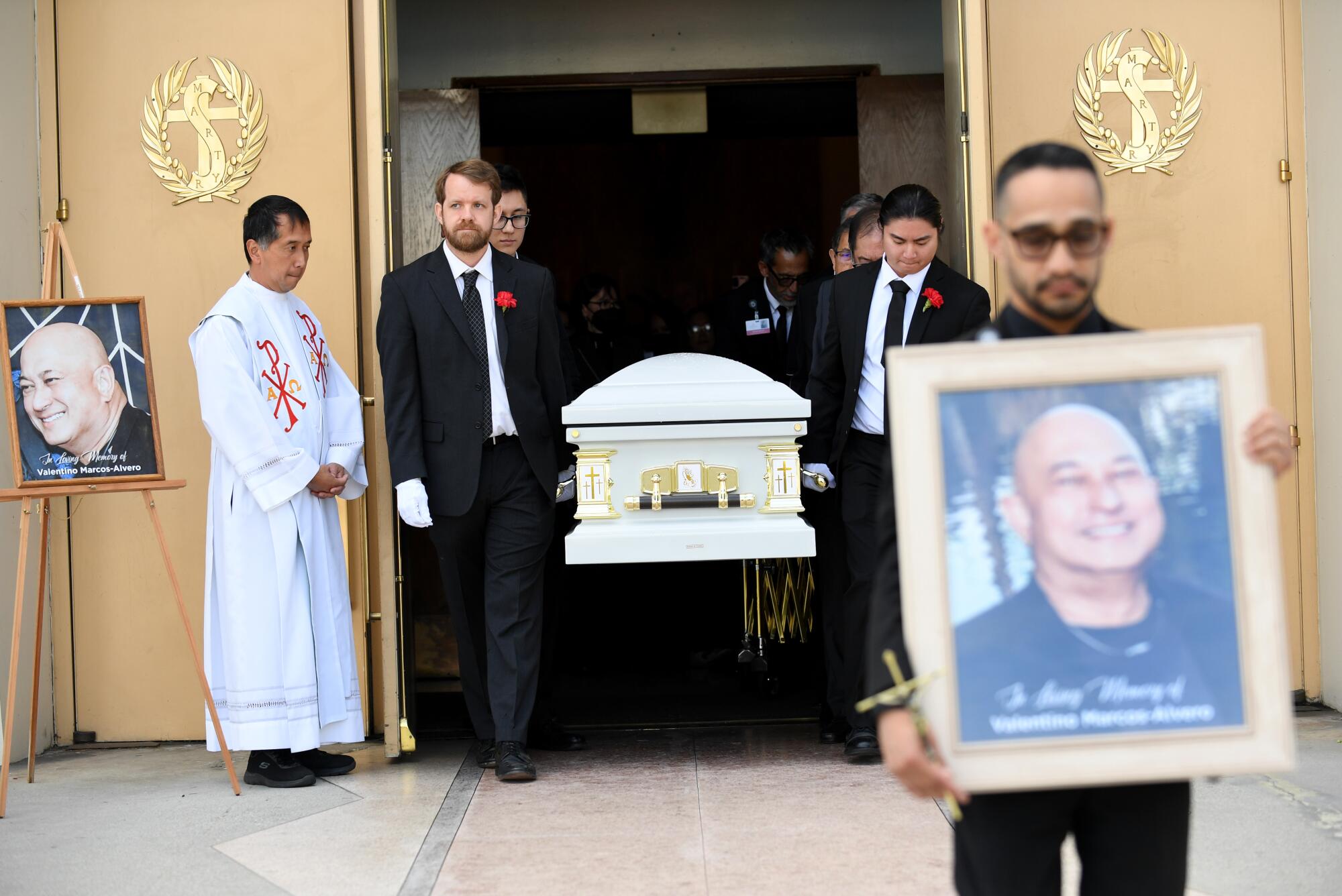 The casket leaves Saint Stephen Martyr Catholic Church.