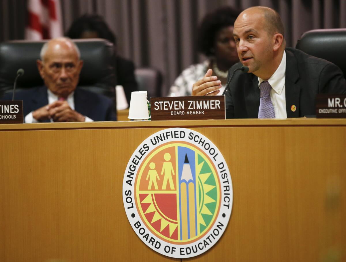 L.A. Unified board President Steven Zimmer addresses fellow board members with outgoing Superintendent Ramon C. Cortines sitting next to him at an annual meeting at district headquarters in July.