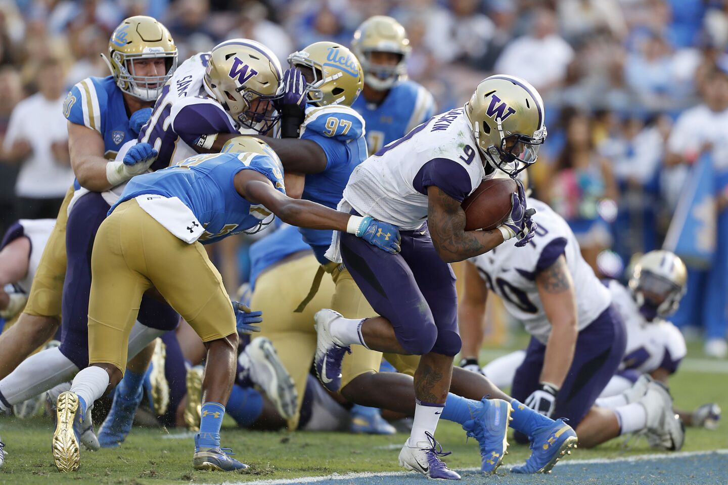 Washington tailback Myles Gaskin scores a touchdown against UCLA in the second quarter on Saturday at the Rose Bowl.