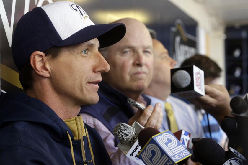 Craig Counsell answers question before batting practice of his first game as Brewers Manager on Monday.