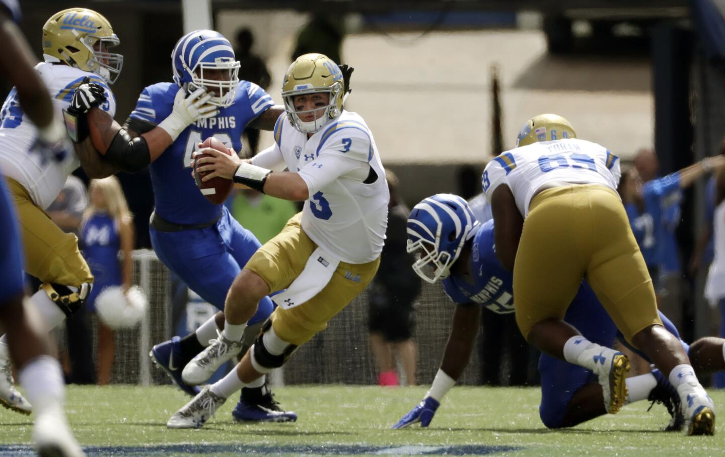UCLA quarterback Josh Rosen (3) scrambles against Memphis during the first half.