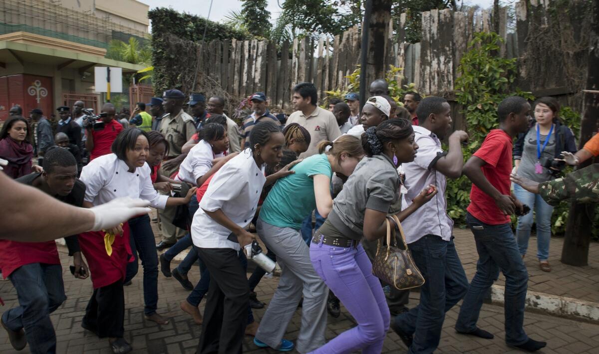 Shoppers flee gunmen at the Westgate shopping mall in Nairobi, Kenya, in 2013. Adan Garar, a senior Shabab leader reported killed in a U.S. drone strike, is believed to have helped plan the attack.