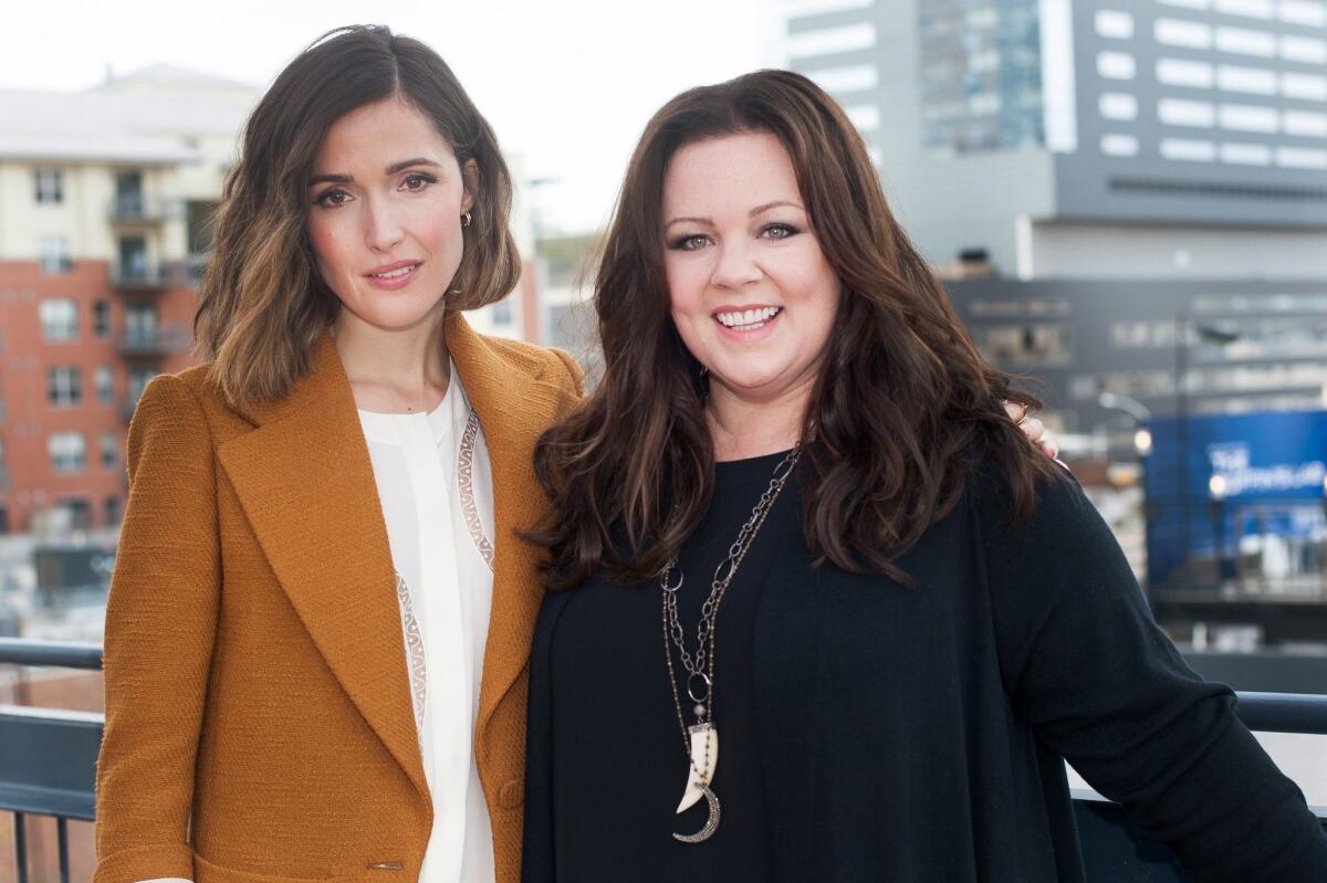 Rose Byrne, left, and Melissa McCarthy on the rooftop patio of the Market on March 15, 2015 in downtown Austin, Texas.