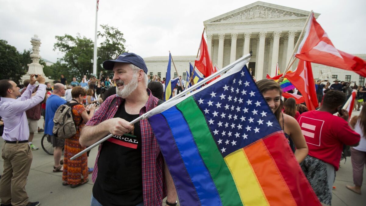 Gay-rights supports rally outside the U.S. Supreme Court building in Washington in 2015. The justices will likely have the final word on a case that extended job discrimination protections to gay people.
