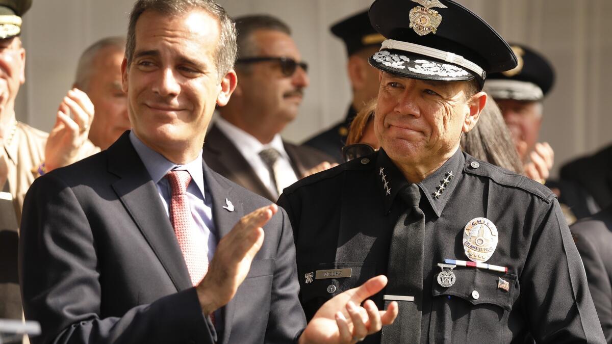 Los Angeles Mayor Eric Garcetti, left, with new LAPD Chief Michel Moore.