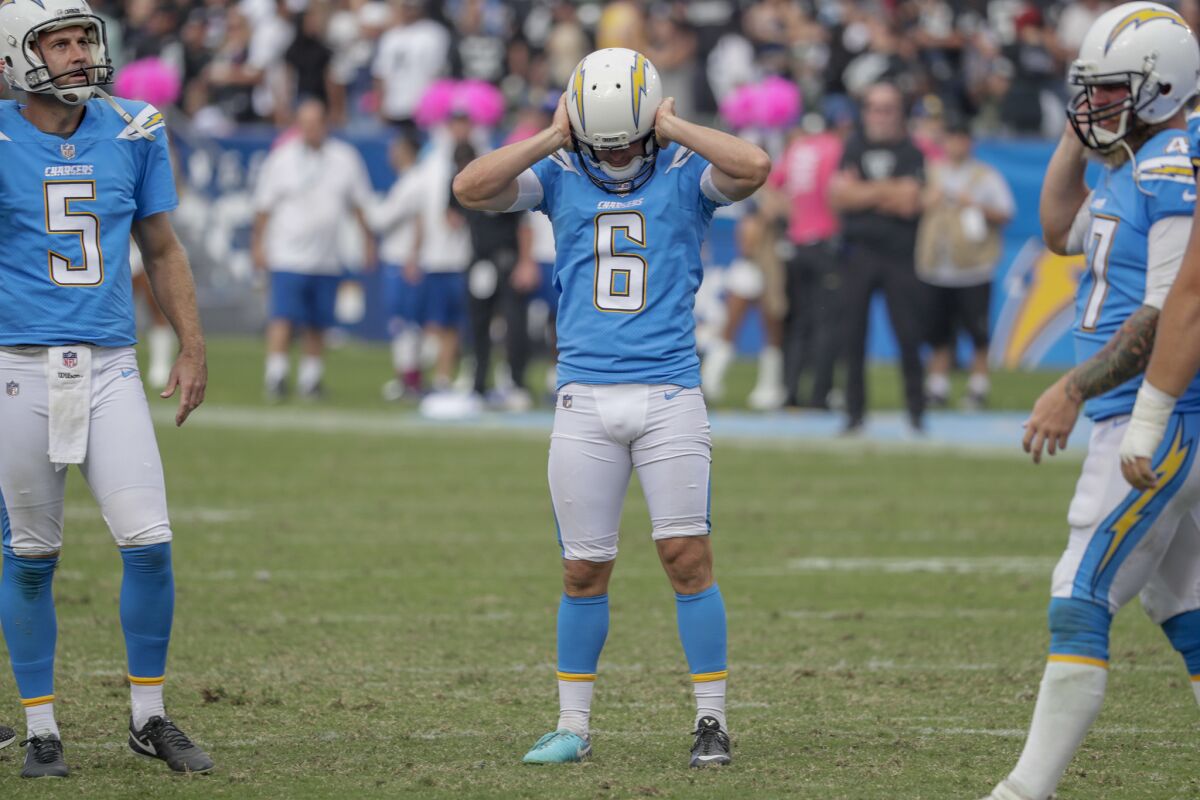 Chargers kicker Caleb Sturgis shows signs of frustration after missing an extra point in the third quarter at StubHub Center on Sunday.