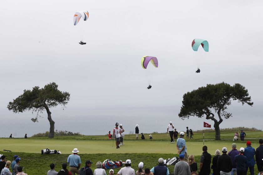 SAN DIEGO, CA - JUNE 18: Paragliders fly near the 4th hole during the second round of the U.S. Open.