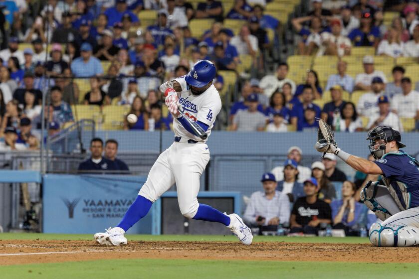 LOS ANGELS, CA - AUGUST 20, 2024: Los Angeles Dodgers Jason Heyward (23) smacks a 3-run pinch hit homer to give the Dodgers a 6-3 win over the Seattle Mariners in the bottom of the eighth inning at Dodgers Stadium on August 20, 2024 in Los Angeles, California. (Gina Ferazzi / Los Angeles Times)