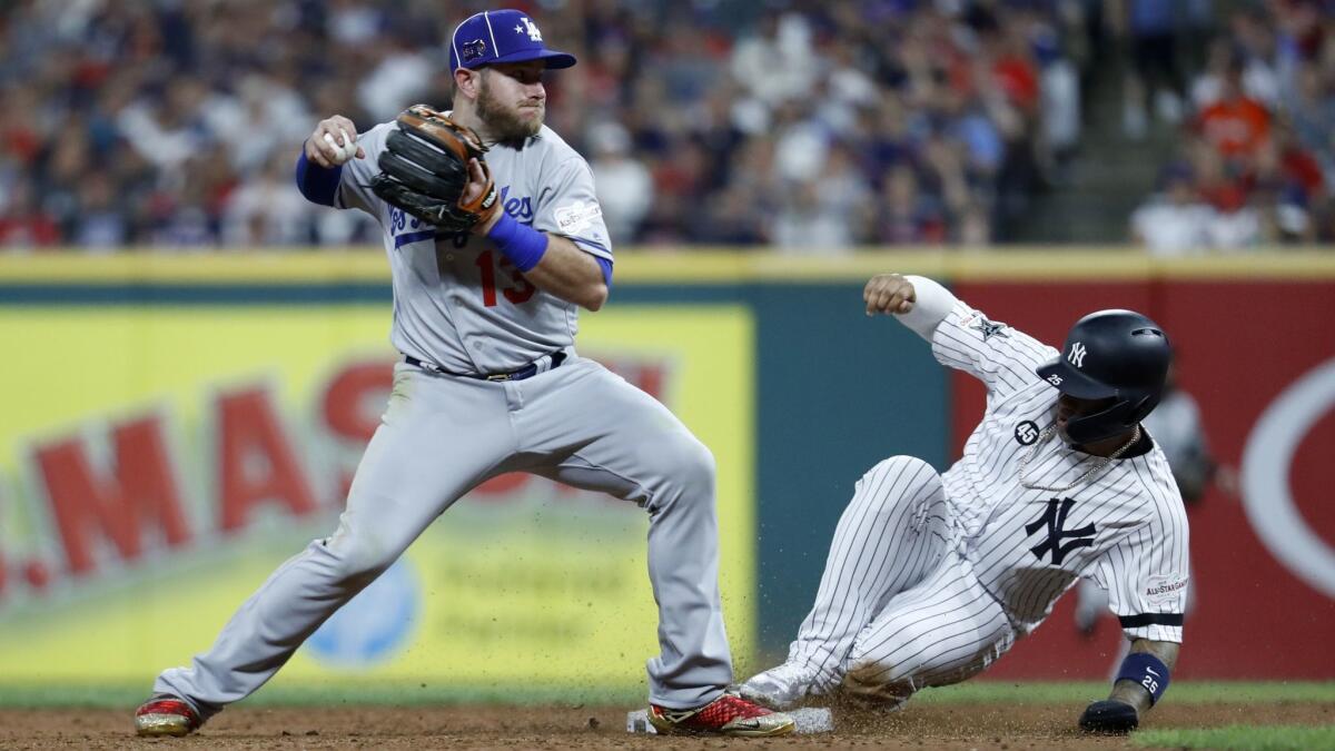 The Yankees' Gleyber Torres is out at second as the Dodgers' Max Muncy turns the double play during the eighth inning of the MLB All-Star Game on Tuesday in Cleveland.