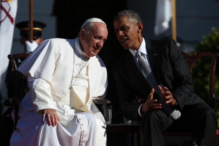 President Obama talks with Pope Francis during the arrival ceremony at the White House.
