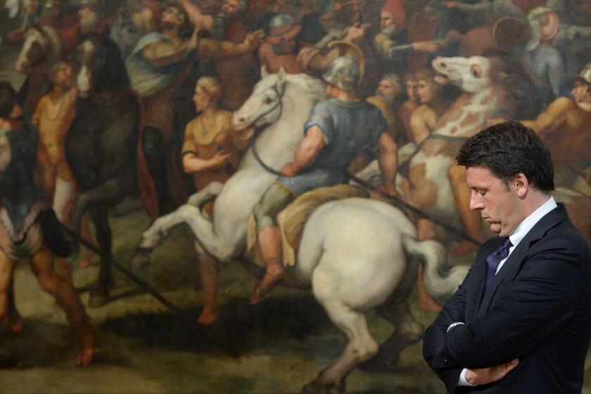 Italian Prime Minister Matteo Renzi stands in front of a fresco in the Palazzo Chigi in Rome in this June 23 file photo.