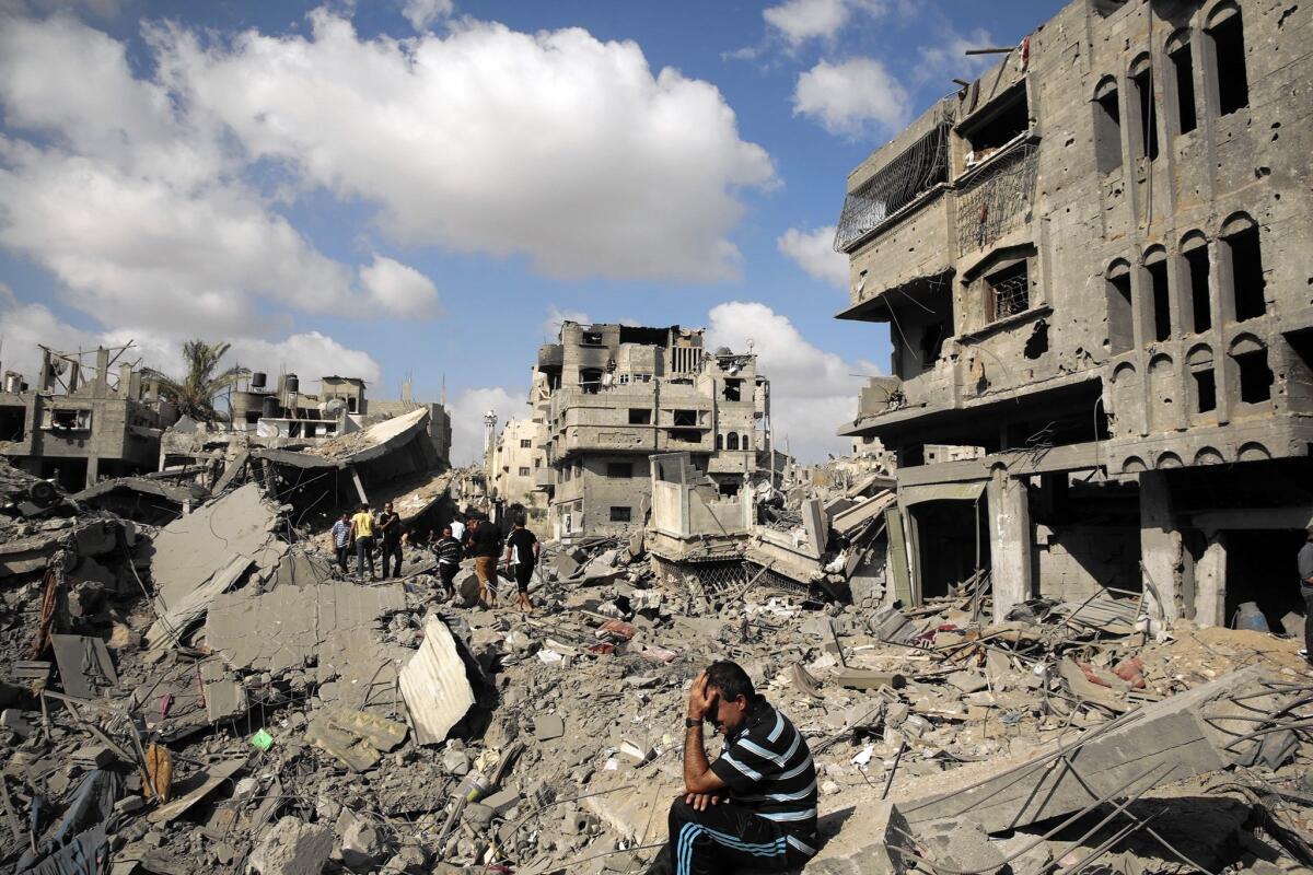 A man grieves at the site of his home in Gaza City's Shajaiya neighborhood in July 2014. Shajaiya came under some of the heaviest bombardment by Israel in the conflict.