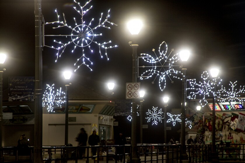 The snowflakes are lit on Huntington Beach Pier in 2019.