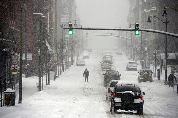 Traffic crawls Saturday in Baltimore as a blizzard crippled travel across the Mid-Atlantic.