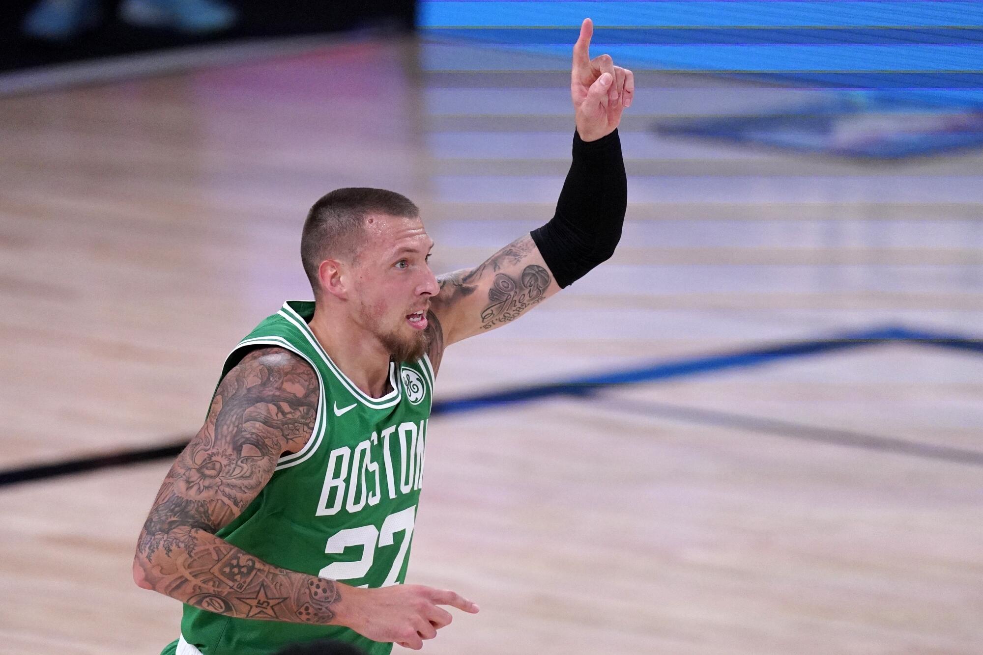 Celtics center Daniel Theis celebrates after scoring against the Heat during a playoff game.