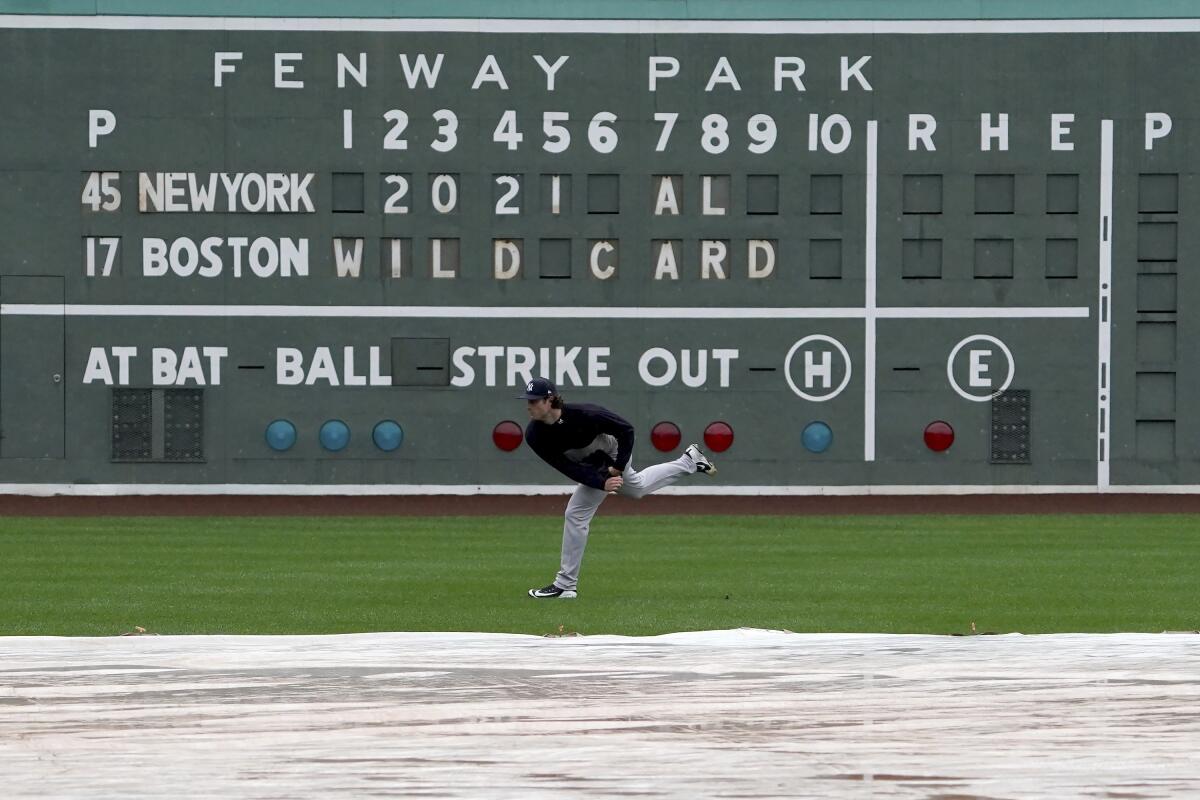 New York Yankees starting pitcher Gerrit Cole throws in the outfield at Fenway Park on Monday.